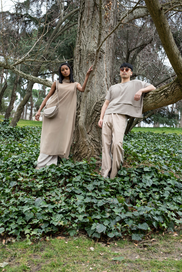 Man and Woman in Beige Monochrome Outfits in the Woods